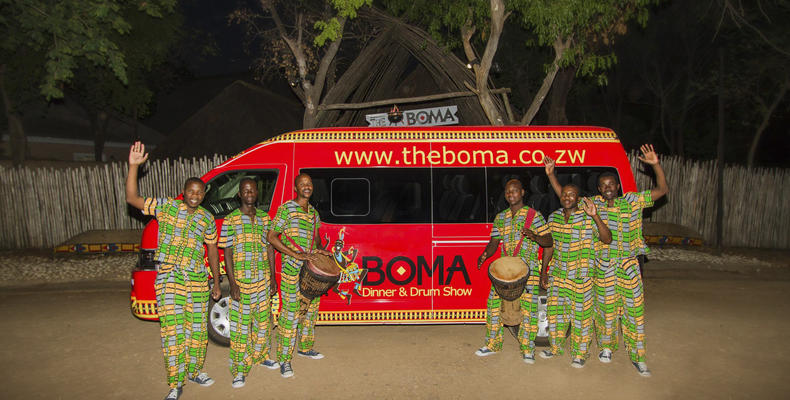 The Boma bus and the drummers at The Boma - Dinner & Drum Show