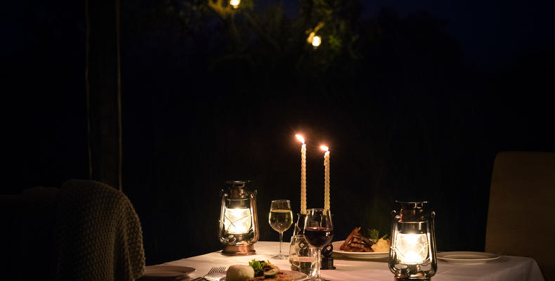 Romantic candlelit dinner in private dining tent