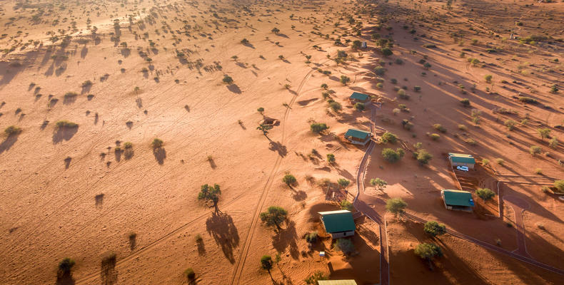 Aerial view of savanna and dune chalets