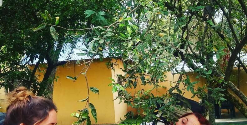 Happy guest enjoying fruits at Runako Lodge