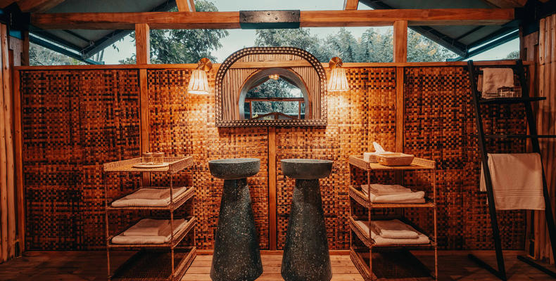 Enclosed bathrooms with double sinks, flush toilet and hot showers.