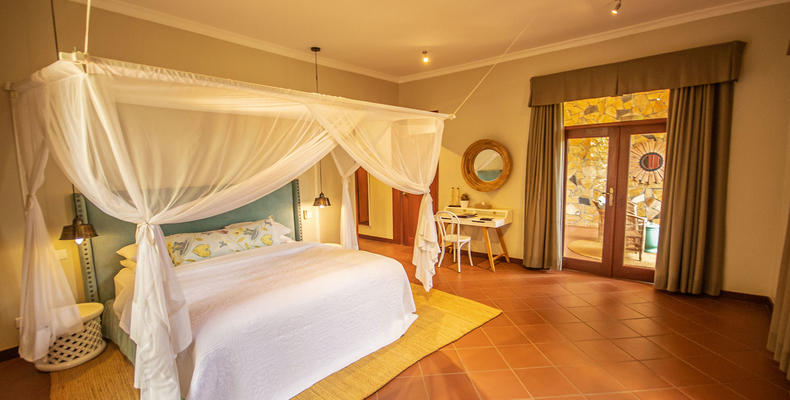 Spacious room with a private sitting room and a private balcony.