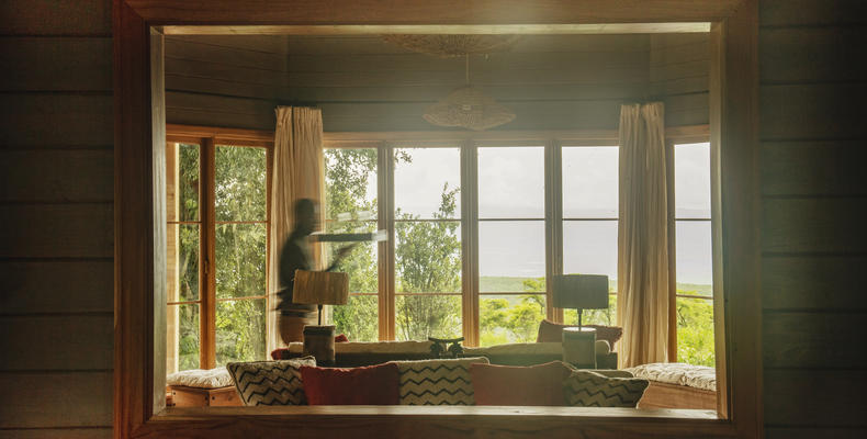 A waiter walks past a window in the Entamanu mess