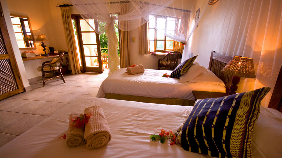 The downstairs Acacia bedrooms are all twins and facing the pool