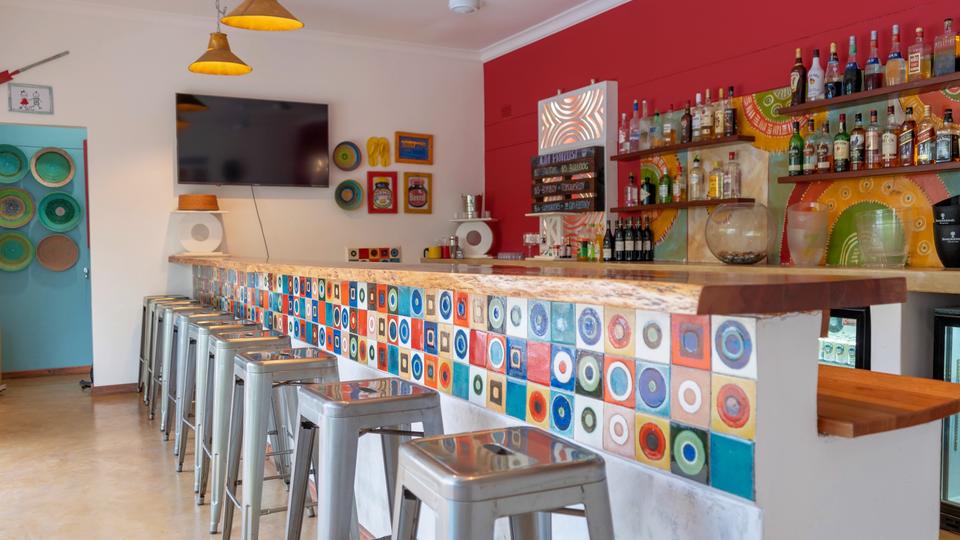 The vibrant and colourful bar is great for having a drink and a chat with our staff, other guests or friends.