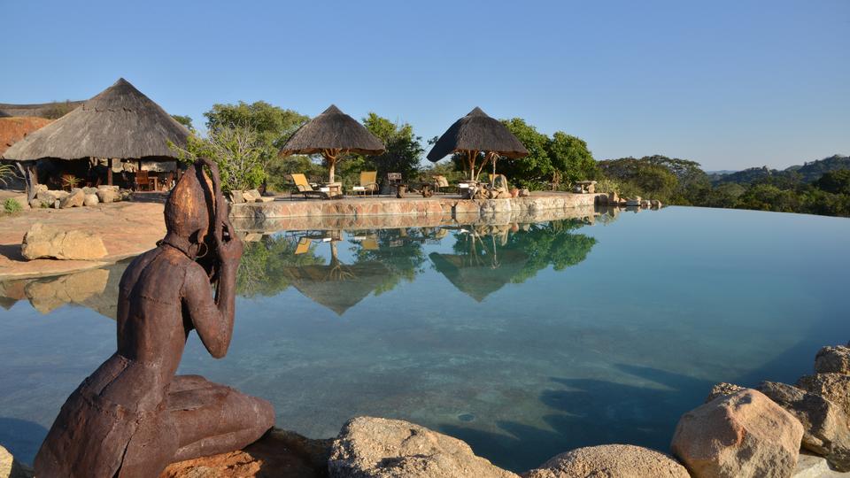The beautiful infinity pool, carved into the granite rock offers you the opportunity to relax &amp; refresh in its cool waters or on the comfortable sunbeds, with breathtaking views over the Matobo Hills and the waterhole below.  Situated next to the sunset lounge, which holds the safari spa where guests can pamper themselves with a range of treatments from full body massages to facials, pedicures &amp; manicures.