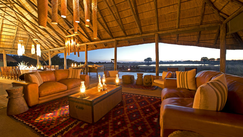 Camp Hwange main lounge area offers comfort and enchanting views over the waterhole