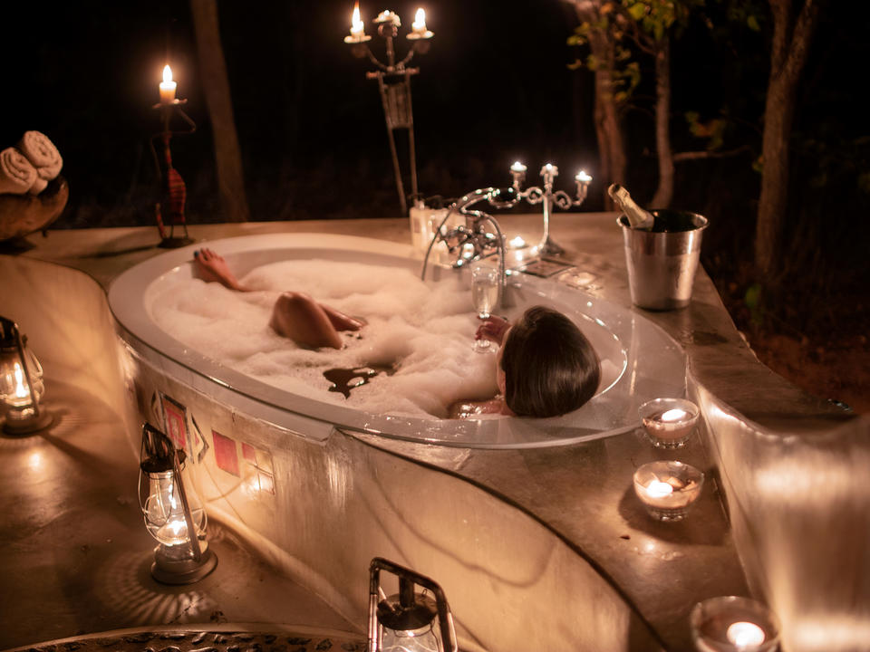 Relaxing in your private outdoor bathtub at the end of a busy day in the bush