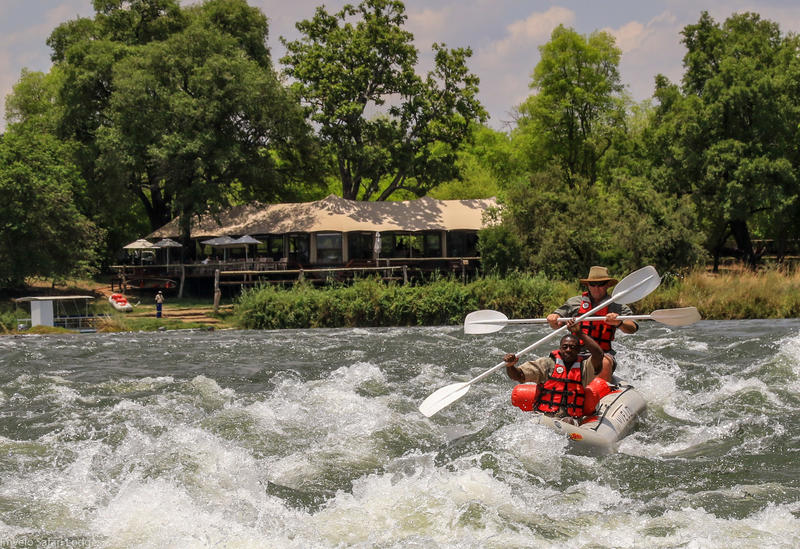 Canoeing the rapids in front of the main lodge