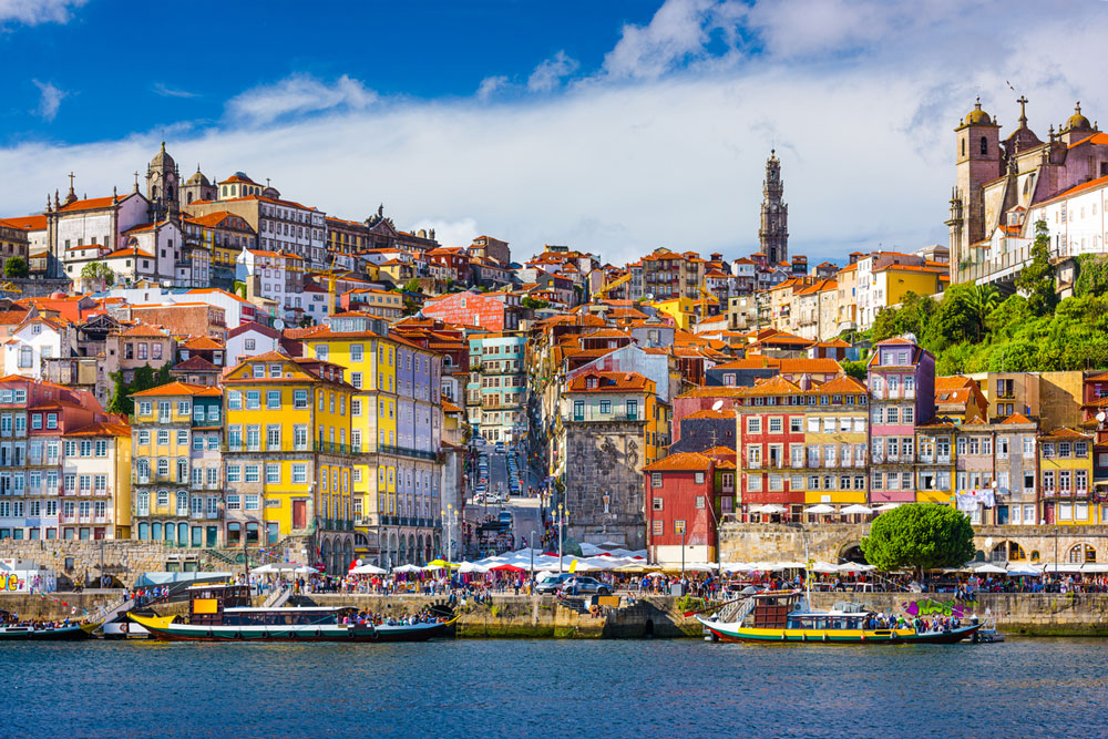 porto portugal old town skyline from across the douro river