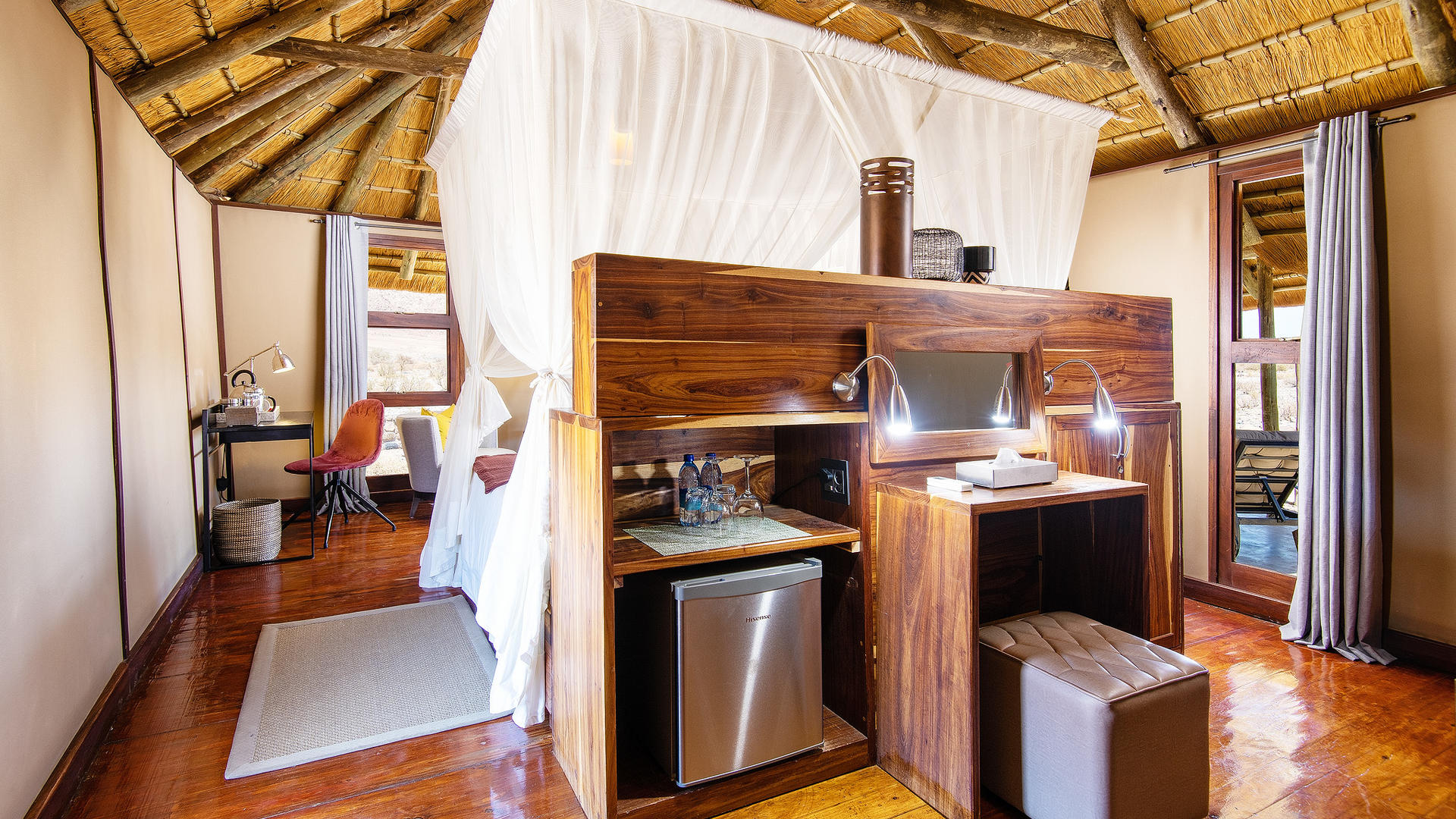 Hoodia Desert Lodge — chalet veranda at dusk